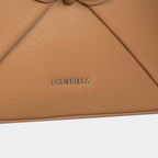 Sac à main avec nœud élégant et coffret cadeau fleuri